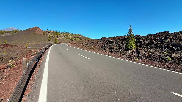 istock A beautiful scenic road that elegantly curves through a stunning volcanic landscape 2231198455