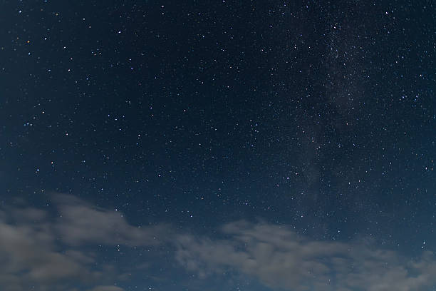 istock Beautiful starry sky with clouds in the night. Night sky background. 2231200358