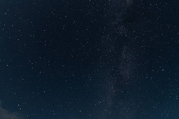 istock Beautiful starry sky with clouds in the night. Night sky background. 2231200369