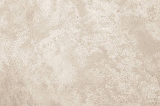 istock Colour old concrete wall texture background. Close up retro plain cream color cement wall background texture. Design paper vintage parchment element. 2231203772