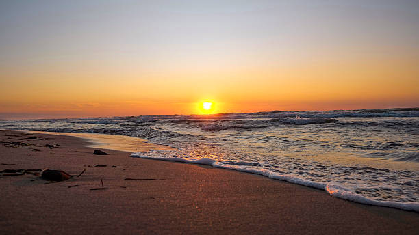 istock Golden Sunset Over Ocean Waves at the Shore 2231204171