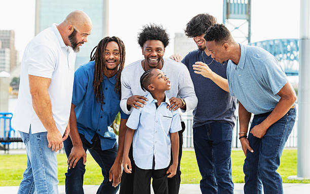 istock Fathers and sons standing in city park on waterfront 2231207407