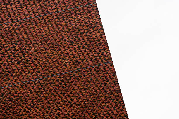 part of brown red brick building and white architecture background