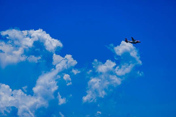 US Coastguard airplane in flight on blue sky over Miami
