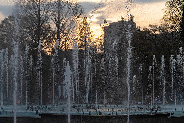 istock fountain in the park during sunset 2231225236