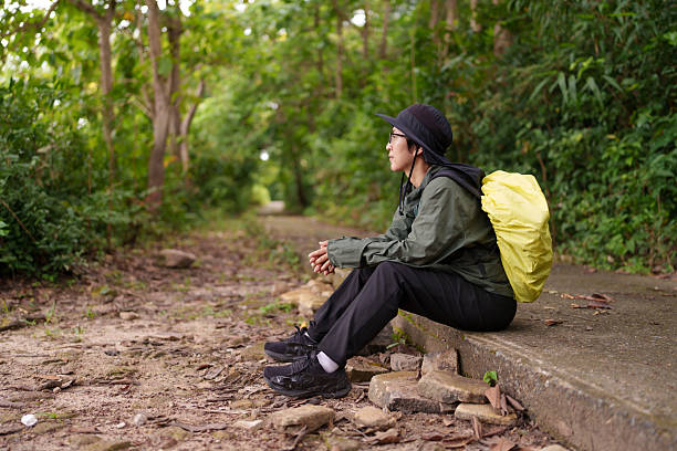 Women are walking through the forest to study natural resources.