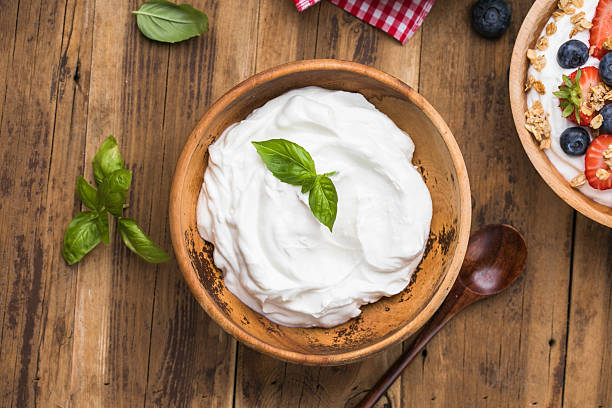 istock Greek Yogurt in wooden bowl 2231226023
