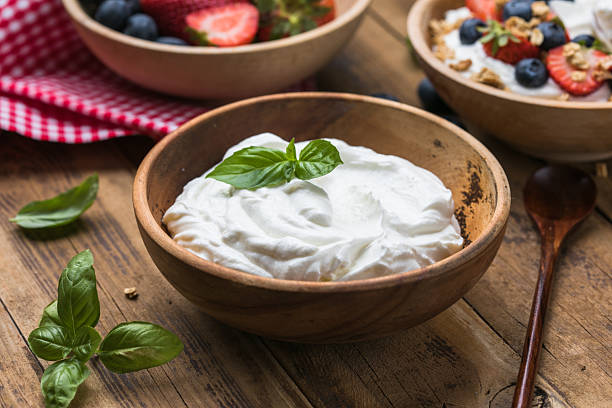 istock Greek Yogurt in wooden bowl 2231226032