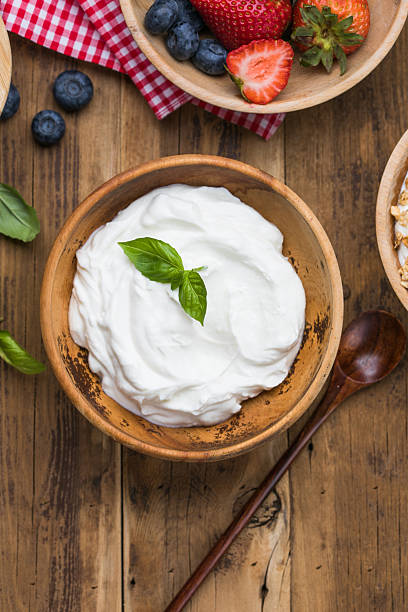 istock Greek Yogurt in wooden bowl 2231226041