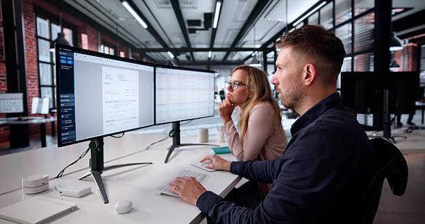 istock Businesswoman And Analyst Overseeing Spreadsheet On Desktop Computer 2231228300