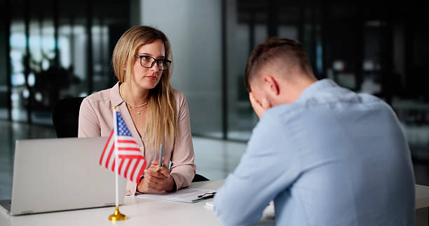 istock Immigration Lawyer Helps Nervous Man Apply 2231230287