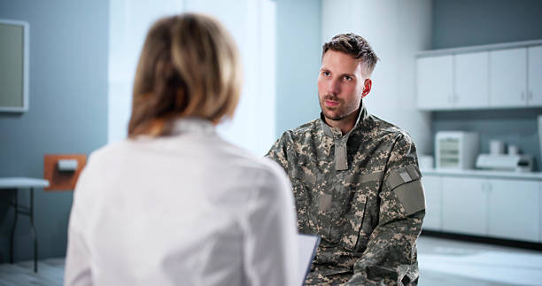 istock Army Doctor Offers Support To Soldier 2231230331