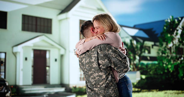 istock Embracing Patriotism: Officer And Soldier Share A Happy 2231230332