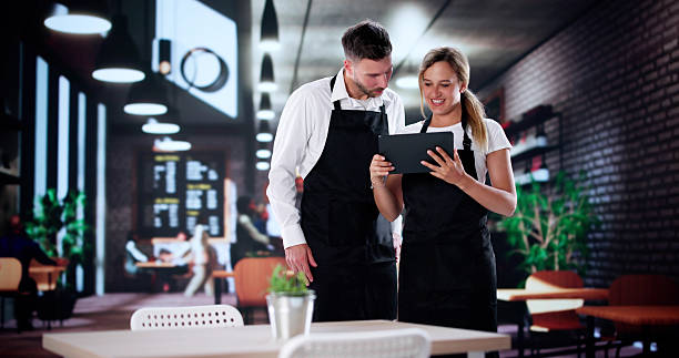 istock Young Restaurateur Discusses Business 2231230414