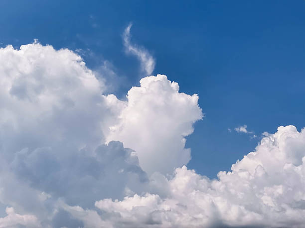 istock Fluffy white clouds against a bright blue sky creating a serene and tranquil atmosphere 2231231389