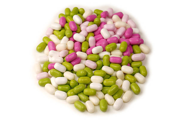 istock Sweet multicolored candies isolated on white background. 2231240085
