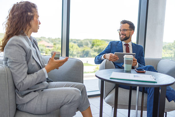 istock Business people discussing during coffee break in modern office 2231242946