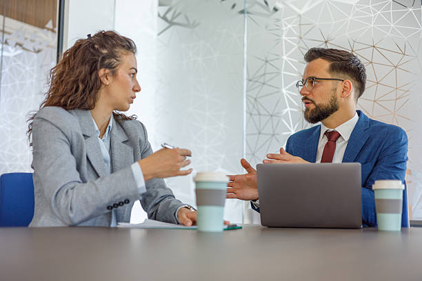 istock Businesspeople discussing work in modern office during meeting 2231243157