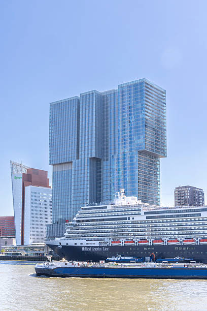 Rotterdam , The Netherlands - May 10, 2025: Holland America Line cruise liner at the waterfront Kop van Zuid near Erasmus Bridge in Rotterdam The Netherlands
