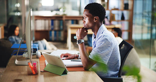 istock Office, intern editor and man on computer for digital magazine, publishing and journalism. Update, media agency and creative person on technology for blog article, publication report and research 2231246985