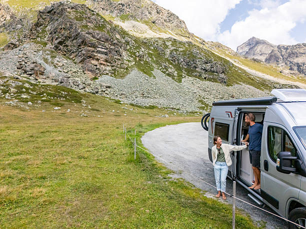 istock Couple Enjoying Mountain Road Trip in Campervan 2231248759
