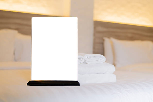 istock White sign cardboard with copy space on hotel bedroom. Hotel interior. 2231251233