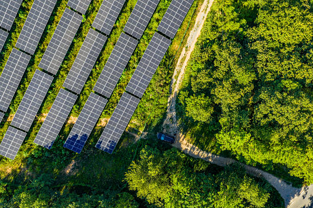 istock Solar photovoltaic panels on a hillside 2231252536