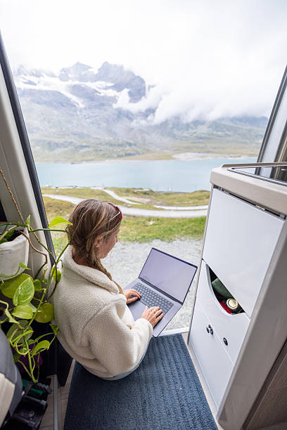 istock Woman Working on Laptop with Mountain View 2231253992