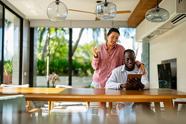 istock A happy, multi-national couple who are digital nomads and work from a different country every month 2231265553