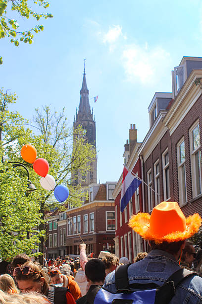 Delft, the Netherlands - April, 2025: Kingsday (Koningsdag - Koninginnedag), the national holiday where the Dutch celebrate the kings birthday on April 27th. Traditionally people will raise the flag. This was in Delft which is known for it's pottery - Delft Blue / Delftware (made at the Royal Delft), the Delft University of Technology (TU Delft), the famous painter Johannes (Jan) Vermeer and it's connections to the Dutch Royal family House of Orange-Nassau.