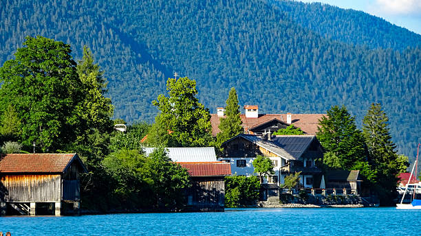 istock Charming lakeside houses with wooden boathouses 2231274698