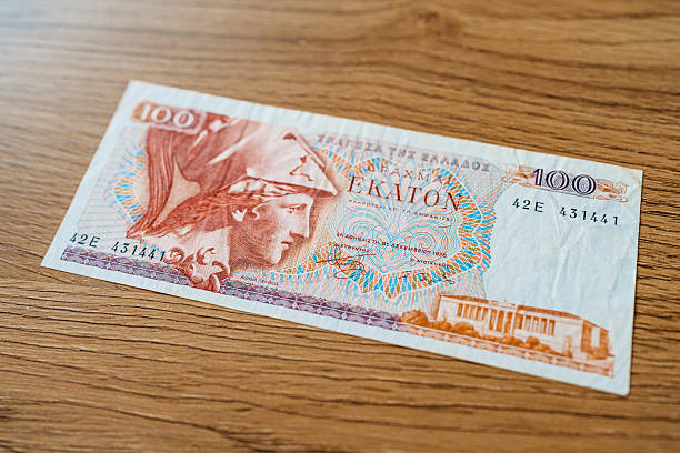 istock 100 Drachma Banknote From Greece On The Table 2231276480