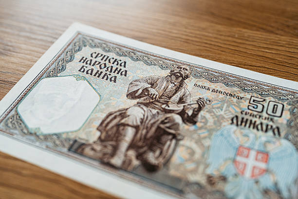 istock 50 Dinar Banknote From Serbia On The Table 2231277044