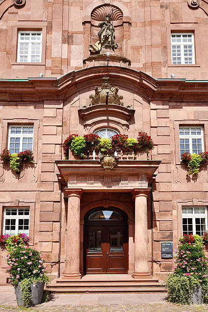 Ettlingen, Germany - August 13th 2025: Entrance of Ettlingen city hall (Rathaus) in Germany. Historic sandstone building with baroque architecture and flowers