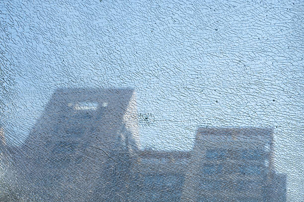 cracked glass of a tall building