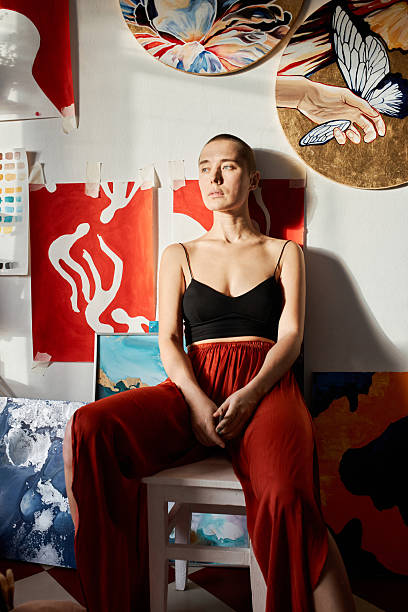 istock Young Professional Artist Sitting Relaxed in Studio Looking Away 2231280497