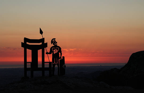 Sunrise in Halászbástya in July. In the backround some young lady waiting for the first light in the dawn. The statau was made by Alajos Strobl in 1906. The  horse is covered by the coronation cloak. In the king's hand is the double cross, and on its head is the crown, above which is a guilded glory.