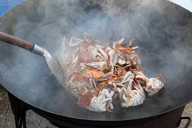 istock home-style stir-fried crab in a large wok 2231281989