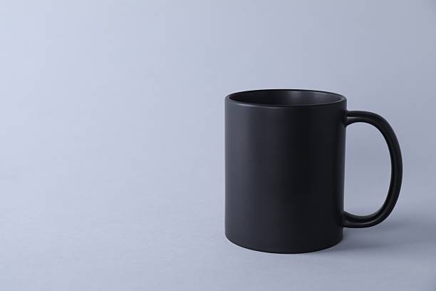 istock One blank black mug on light background. Mockup for design 2231282079