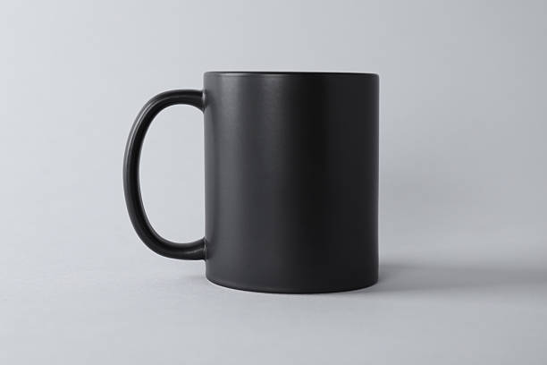 istock One blank black mug on light background. Mockup for design 2231282547