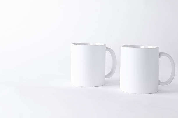 istock Two blank mugs on white background. Mockup for design 2231282561