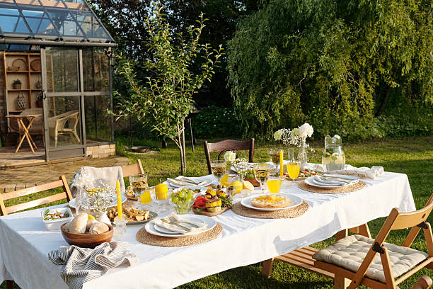istock Outdoor Summer Garden Table Setting Featuring Fresh Food and Drinks 2231286769