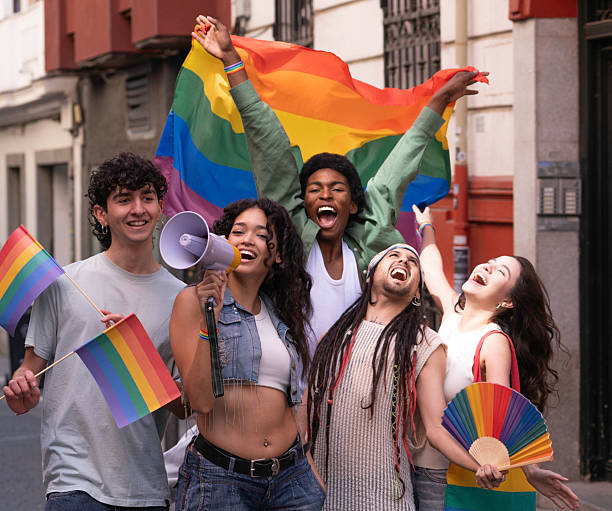 istock Young activists marching for equal rights at gay pride parade 2231289240