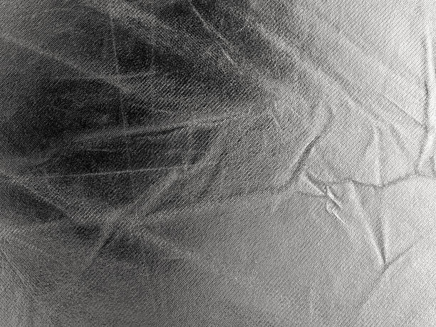 istock Silver Satin Surface With Creases And Scratches 2231289335