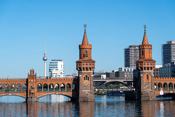 Germany, Berlin, Kreuzberg, Oberbaum Bruecke, August 19, 2025 - Berlin's Oberbaum Bridge over the Spree against a clear sky