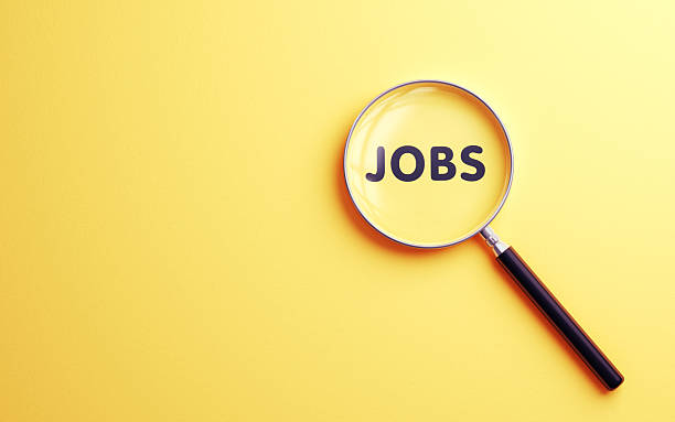 istock Jobs Text Selected with Metallic Magnifying Glass on Soft Blue Background 2231292658