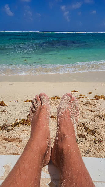 istock Tourist relaxing on a tropical beach enjoying summer vacation 2231293756