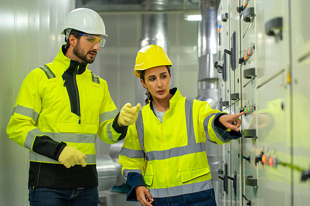 istock Two Latin American engineers discussing HVAC system maintenance and chiller installation in an industrial plant. 2231295141