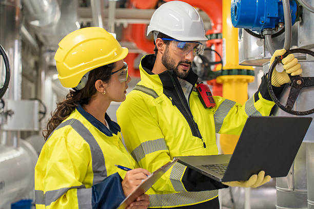 istock Two colleagues examining fan and refrigeration infrastructure for power efficiency in an industrial facility. 2231295147