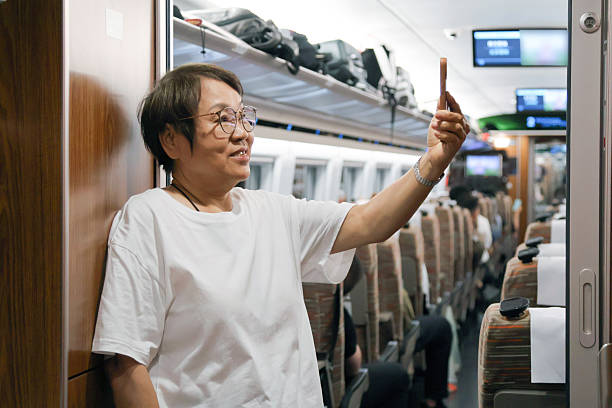 A happy traveler leaning out of a train door, embracing the fresh air and scenic beauty of tea fields. The image conveys the joy of slow travel, cultural immersion, and breathtaking landscapes, perfect for promoting tourism, eco-travel, and destination experiences.